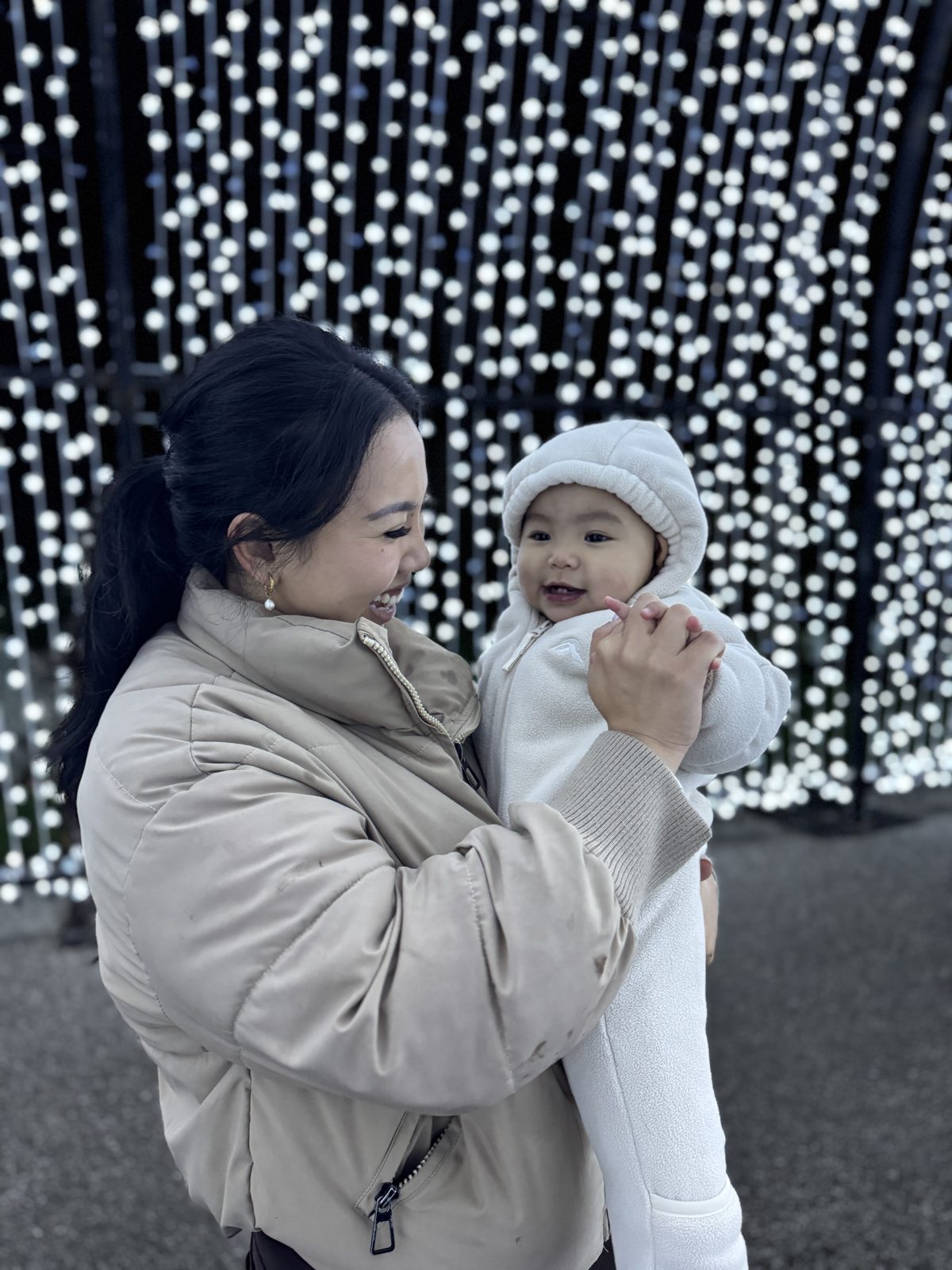 Nadia, founder of By Evie, laughing with her daughter Evie