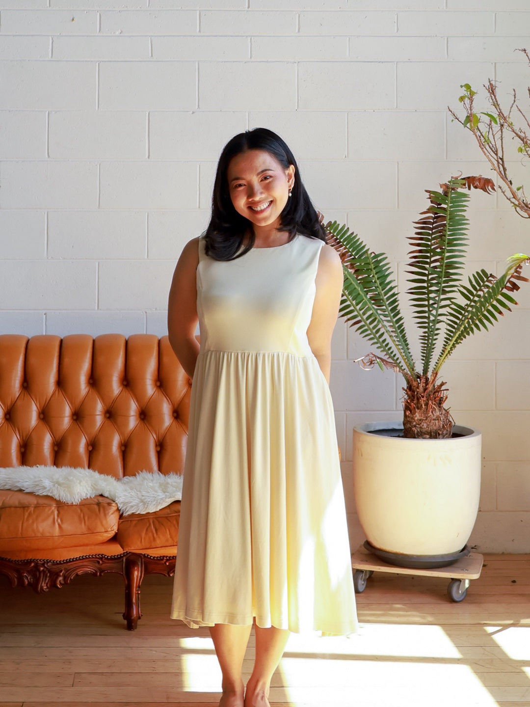 Petite mum smiling in the Petite Maternity & Breastfeeding Dress in Butter, full length