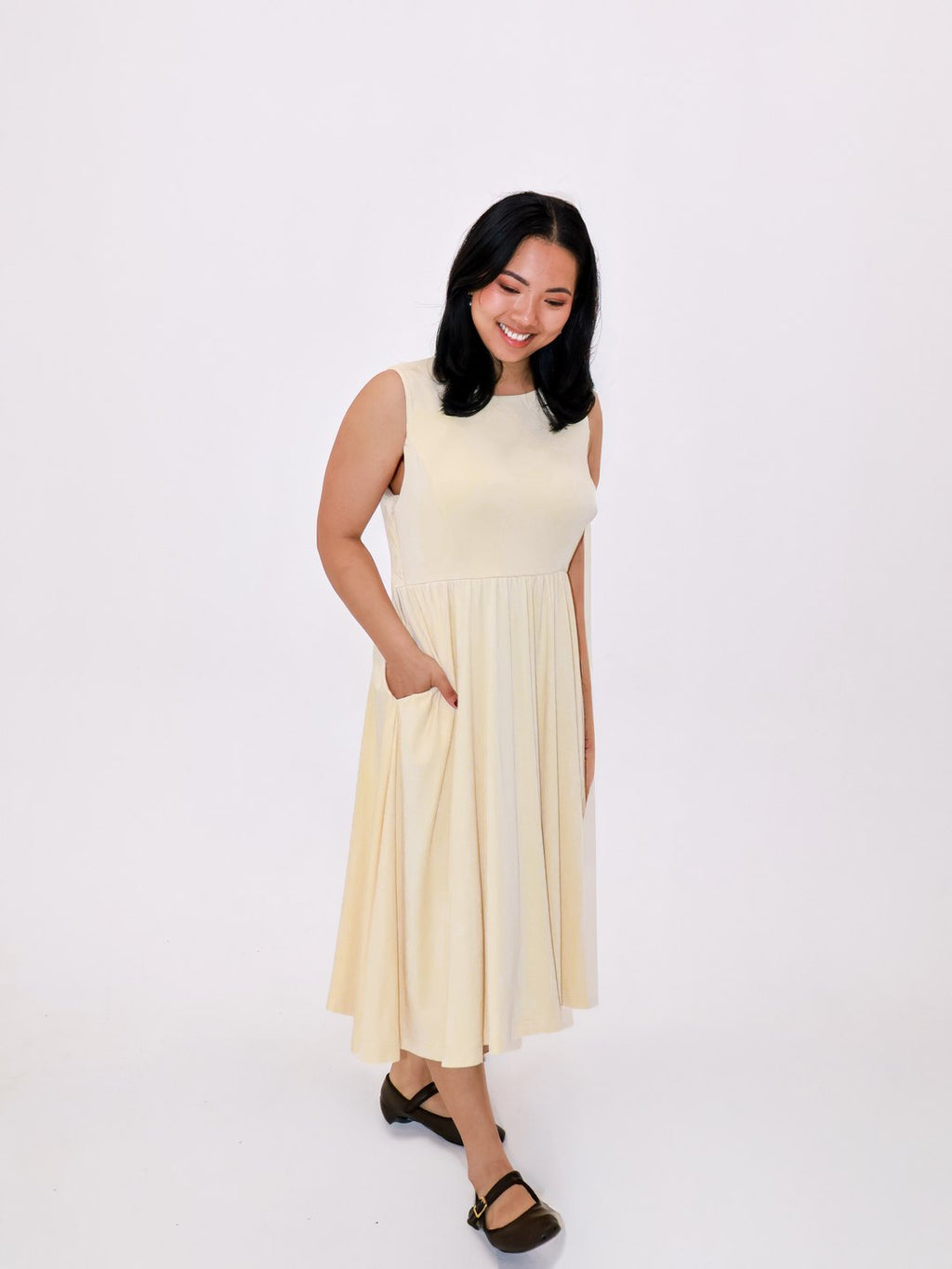 Petite Maternity & Breastfeeding Dress in Butter with a hand in the side pocket