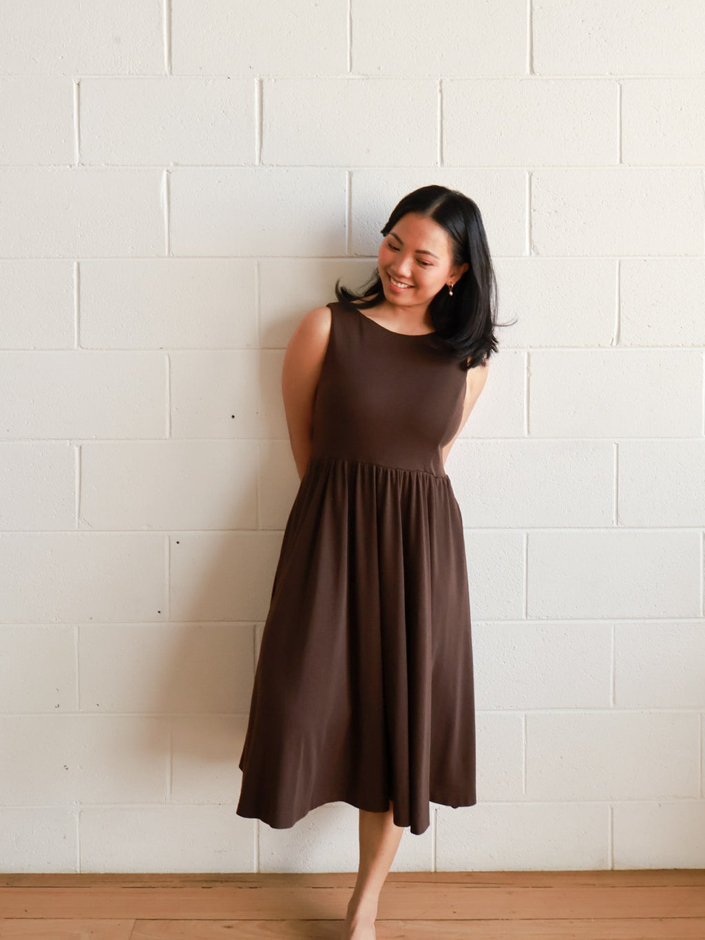 Petite mum smiling in the Petite Maternity & Breastfeeding Dress in Dark Chocolate, full length