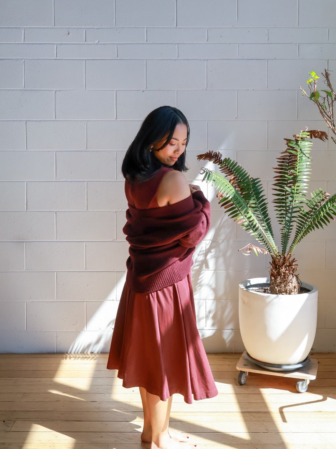 Petite mum in the Petite Maternity & Breastfeeding Dress in Red Wine, styled with a knit cardigan
