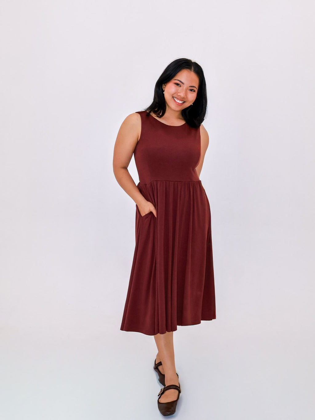 Petite Maternity & Breastfeeding Dress in Red Wine with a hand in the side pocket